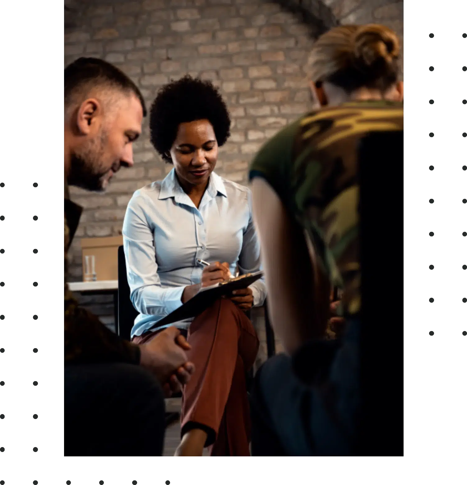female psychologist talking to group